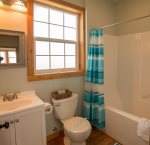 Guest full bathroom with tub and shower 